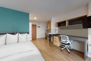 a bedroom with a bed and a desk and a chair at Private Bedrooms with Shared Kitchen, Studios and Apartments at Canvas Arundel House in the heart of Coventry in Coventry