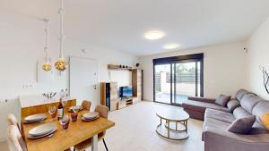 a living room with a couch and a table at Villa Solar - A Murcia Holiday Rentals Property in Roldán