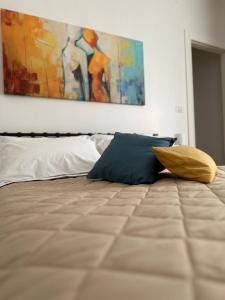Postel nebo postele na pokoji v ubytování B&B L'ULIVO