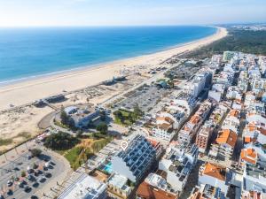an aerial view of a beach and buildings at Kasino II 3ºI in Monte Gordo