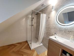 a bathroom with a shower and a sink at Kwietny Stoczek 70 in Białowieża +55 photos