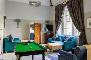 a living room with a pool table in it at The New School Rooms - Beautiful, Georgian Apartment with Private Heated Pool and Hot Tub Sleeps 12 with Wifi and Parking near Bath in Box