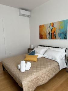 Postel nebo postele na pokoji v ubytování B&B L'ULIVO