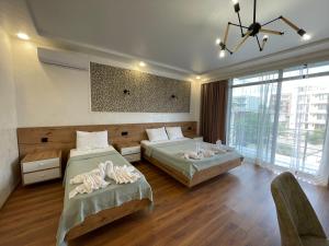 Letto o letti in una camera di Hotel Sunlight