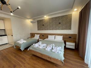 Letto o letti in una camera di Hotel Sunlight