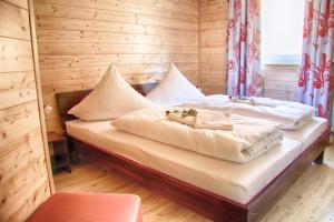 Ένα ή περισσότερα κρεβάτια σε δωμάτιο στο Wildberghof