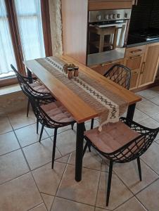 a table with a keyboard on it in a kitchen at Niko's Stone Guest House in Plitra