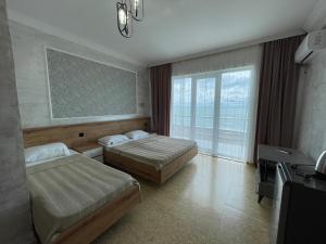 Letto o letti in una camera di Hotel Sunlight