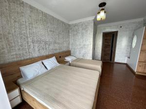 Letto o letti in una camera di Hotel Sunlight