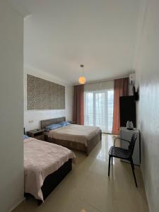 Letto o letti in una camera di Hotel Sunlight