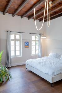 Postel nebo postele na pokoji v ubytování Mila - Boutique Hotel