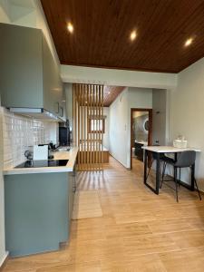 a kitchen with a counter and a table in a room at Rosemary Studio in Chorto +21 photos