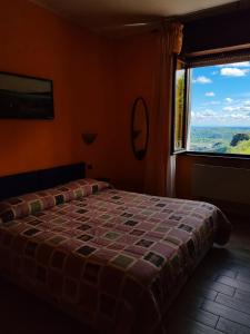 Postel nebo postele na pokoji v ubytování Hotel Panoramico SPA lago d'Orta Only Adults