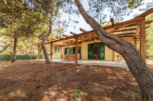 a house with a wooden roof at Villa Moscariello - Beach & Sea in Ascea