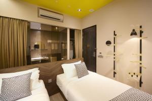 Hotel Yan客房内的一张或多张床位
