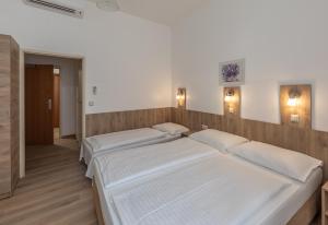 Postelja oz. postelje v sobi nastanitve Hotel Terminus