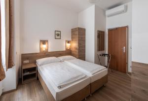 Postelja oz. postelje v sobi nastanitve Hotel Terminus
