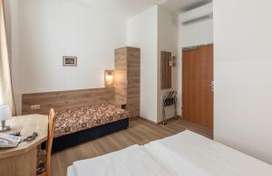 Postelja oz. postelje v sobi nastanitve Hotel Terminus