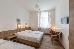 Postelja oz. postelje v sobi nastanitve Hotel Terminus