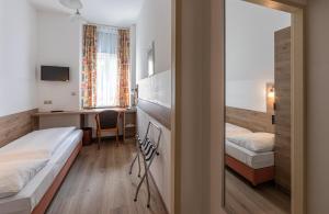 Postelja oz. postelje v sobi nastanitve Hotel Terminus