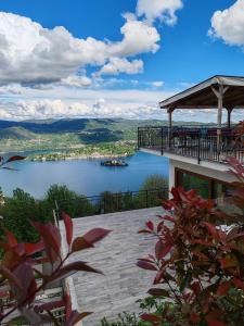 a building with a view of a lake at Hotel Panoramico lago d'Orta in Madonna del Sasso