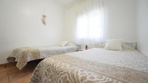Postel nebo postele na pokoji v ubytování Casa Uly