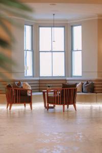 a living room with two chairs and a couch at Esplanade Hotel Llandudno in Llandudno