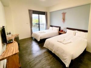 Letto o letti in una camera di 阿郎衝浪旅店A-lang Surfing House