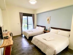 Letto o letti in una camera di 阿郎衝浪旅店A-lang Surfing House