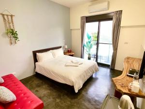 Letto o letti in una camera di 阿郎衝浪旅店A-lang Surfing House
