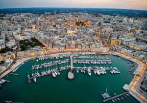 an aerial view of a harbor with boats in the water at ARCO in Bisceglie