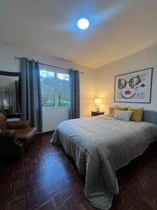 Postel nebo postele na pokoji v ubytování Villa Correia - Ribeiro Frio