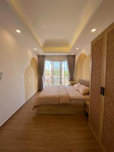 เตียงในห้องที่ Holiday Villa Novaworld Phan Thiet