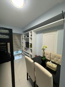 TV a/nebo společenská místnost v ubytování SMDC WIND RESIDENCES