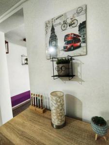 a corner of a room with a wall with a picture of a car at Apartman Monroe in Sarajevo