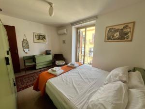 Posteľ alebo postele v izbe v ubytovaní home.70 Carini