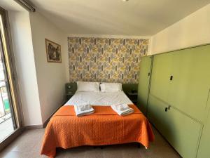 Posteľ alebo postele v izbe v ubytovaní home.70 Carini