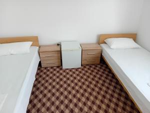 Postel nebo postele na pokoji v ubytování Adi