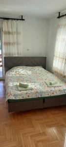 Postel nebo postele na pokoji v ubytování Apartments P&P + 3 fotografie