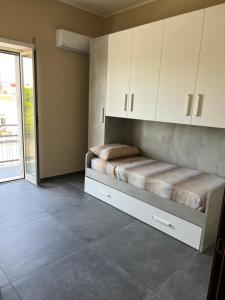 Postel nebo postele na pokoji v ubytování Appartamenti Minturnae Relais