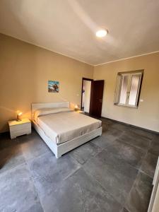 Postel nebo postele na pokoji v ubytování Appartamenti Minturnae Relais
