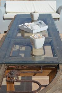a coffee table with two bowls on top of it at Villa Aristoteles in Halki