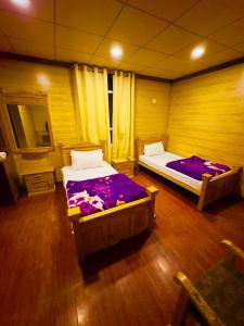Gems Palace Hotel Sost客房内的一张或多张床位