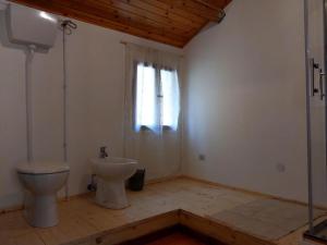 a bathroom with a toilet and a sink at Mirabilia 3 in Chioggia