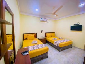 Postel nebo postele na pokoji v ubytování Sparkling Resort Kataragama