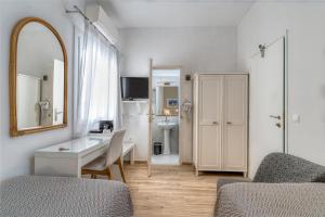 A kitchen or kitchenette at Manto Hotel