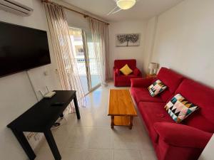 Un televizor și/sau centru de divertisment la Apartamentos Bitacora Altamar