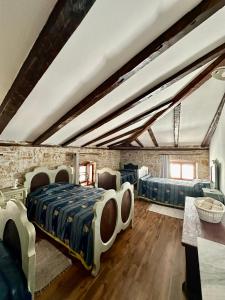 a bedroom with two beds in a attic at Rural Apartments Ritossa in Vižinada