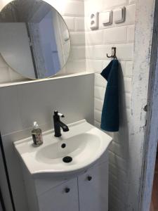 a bathroom with a white sink and a mirror at Hostel Moravia Ostrava in Ostrava +90 photos