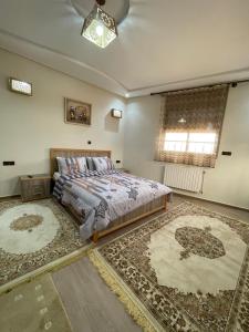 A bed or beds in a room at Jaddou Home